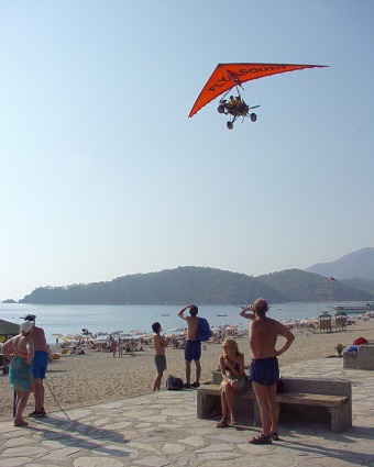  Powered hangglider above the beach 